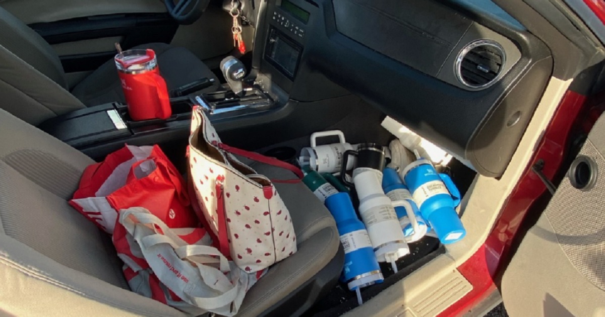 Stanley Quencher cups reported stolen from a retail store outside Sacramento, California, a pictured on the front seat of a car pulled over by police.