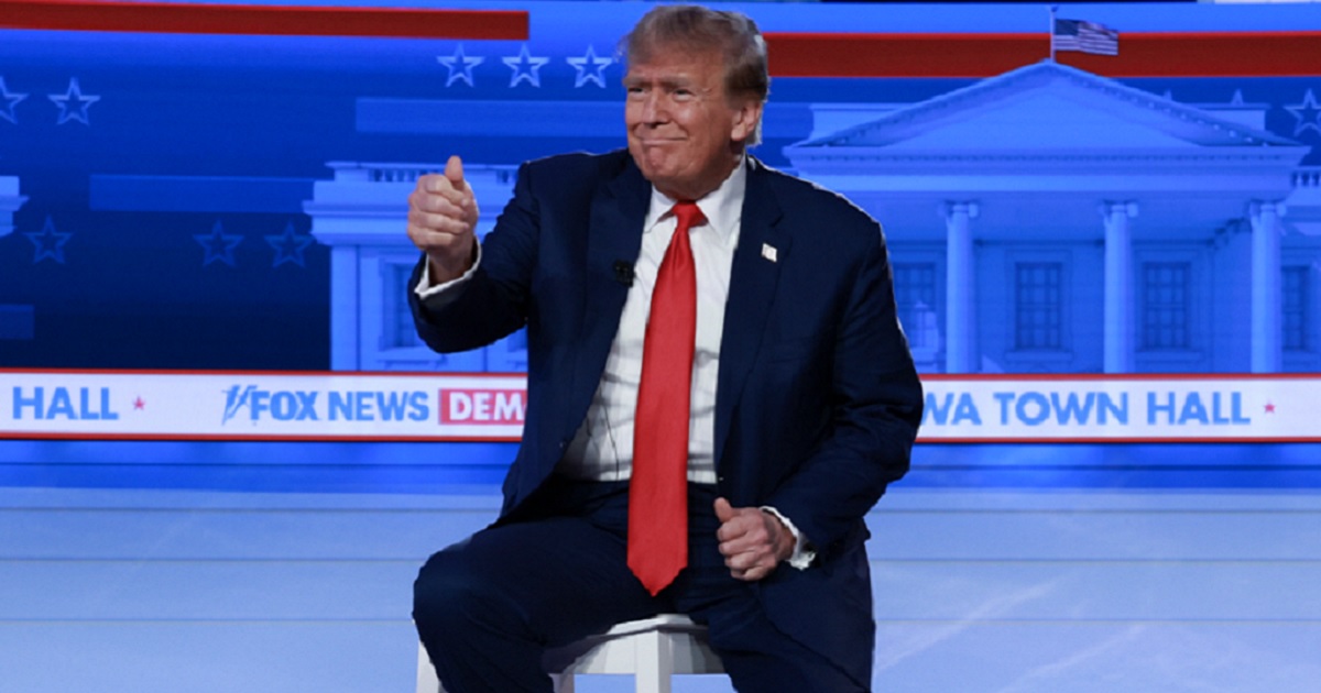 Former President Donald Trump gives the crowd a thumbs-up on Wednesday at a town hall event in Des Moines, Iowa, aired by Fox News.
