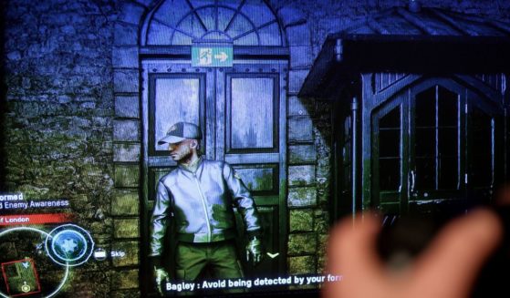 This picture taken on October 28, 2020, in Brussels, shows a screen displaying the new Ubisoft video game "Watch Dogs Legion". The game released on Octoer 28, 2020, by French studio Ubisoft is set in a dystopian near-future London, haunted by authoritarian surveillance and the ghost of Brexit.