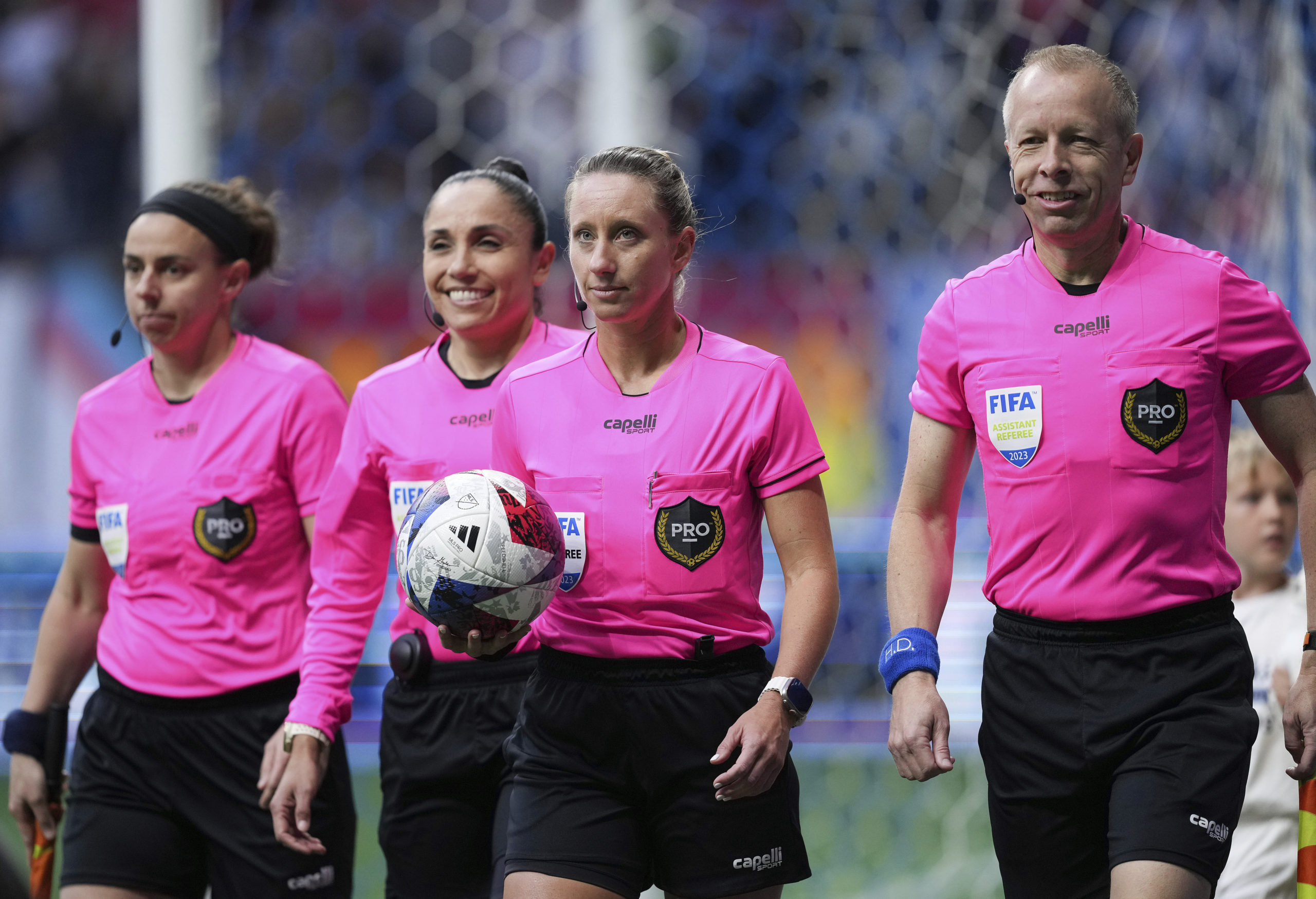 Referee Tori Penso, second from right; fourth official Felisha Mariscal, second from left; and assistant referees Brooke Mayo, left, and Corey Rockwell, right, walk onto the field before the Vancouver Whitecaps and Colorado Rapids played in an MLS soccer match April 29, 2023, in Vancouver, British Columbia. Major League Soccer will lock out referees after its union rejected a tentative contract, putting Lionel Messi’s Inter Miami on track to open the season with replacement officials.