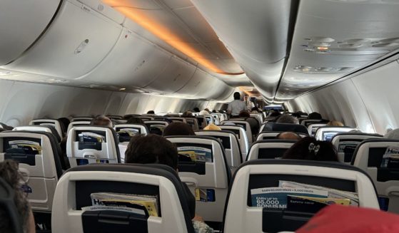 The interior of a commercial airplane is shown.