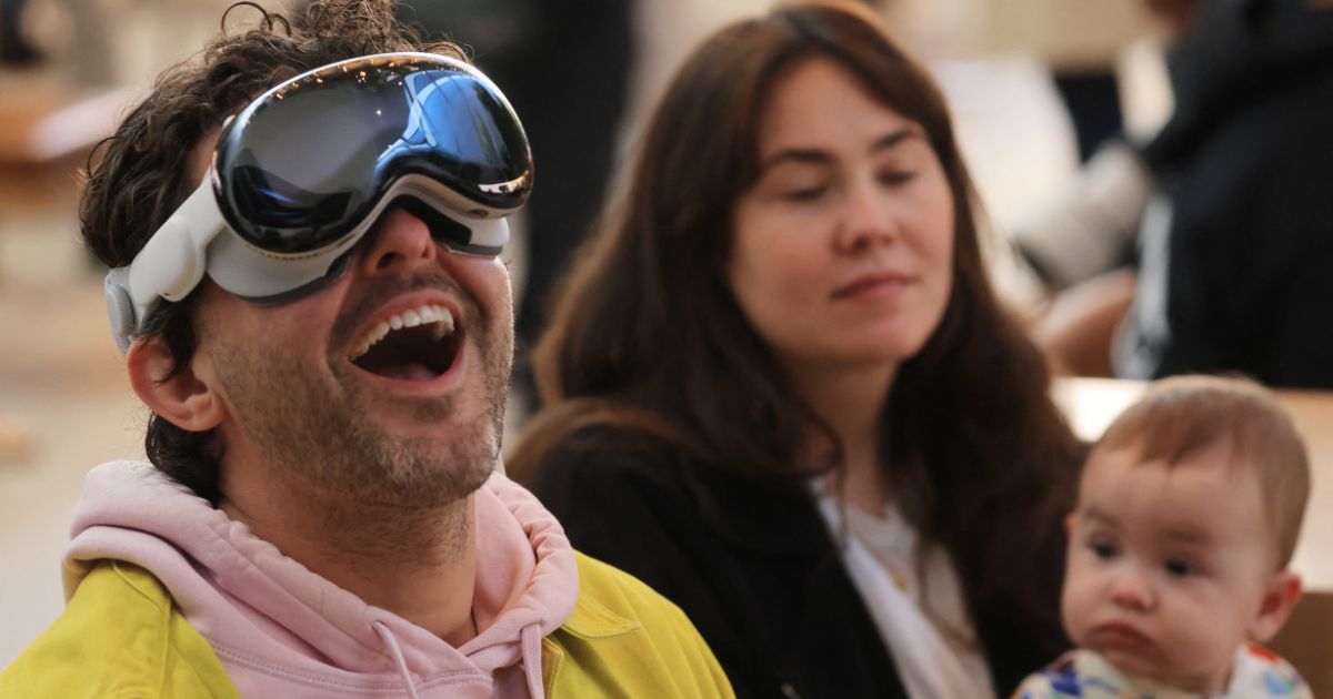 A customer tries the Apple Vision Pro during the product's launch at Apple The Grove in Los Angeles on Friday.