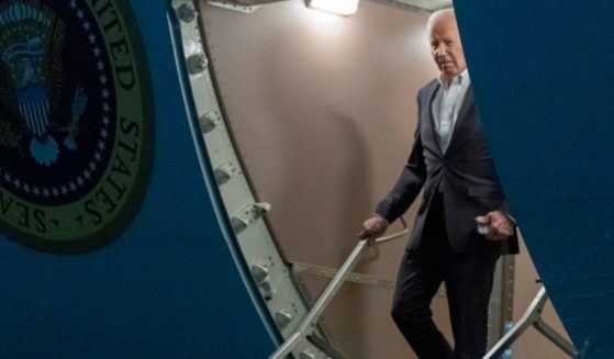 President Joe Biden walks down the ramp of Air Force One as he arrives at Andrews Air Force Base, Maryland, on Thursday.