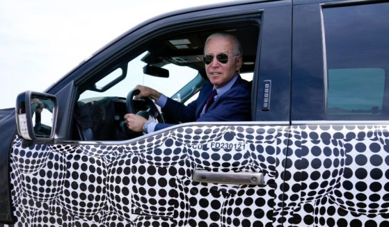 President Joe Biden is seen driving a Ford F-150 Lightning truck at Ford Dearborn Development Center in a file photo from May 2021.