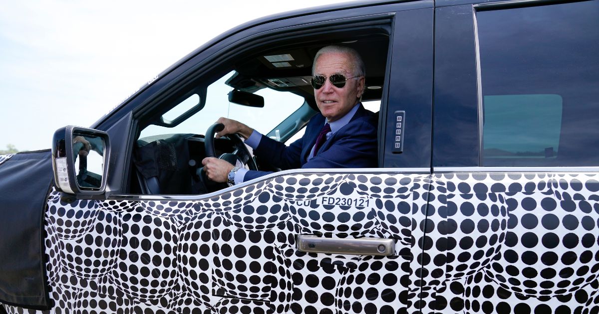 President Joe Biden is seen driving a Ford F-150 Lightning truck at Ford Dearborn Development Center in a file photo from May 2021.