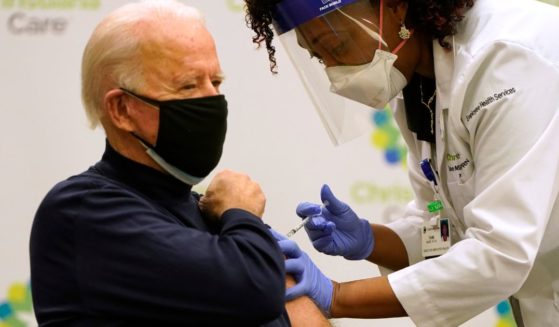 Joe Biden receives a COVID-19 vaccination from nurse practitioner Tabe Mase at ChristianaCare Christiana Hospital in Newark, Delaware, on Dec. 21, 2020.