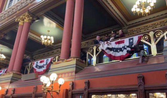 Police officers remove protesters from the Connecticut Capitol in Hartford.