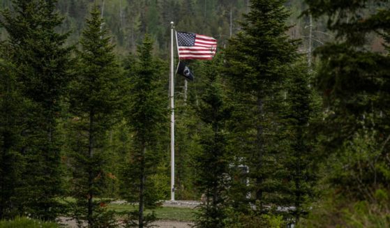 An American flag flies at Patriot Park, a collection of monuments in tribute to veterans in Columbia Falls, Maine.