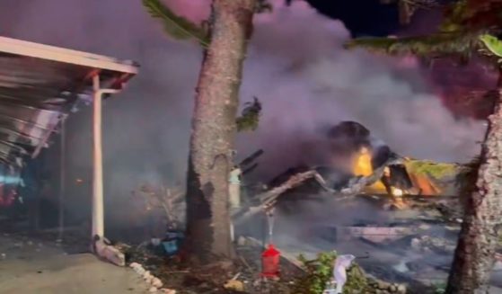 A small plane crashed into a senior living community Friday in Clearwater, Florida, striking a mobile home before bursting into flames. .