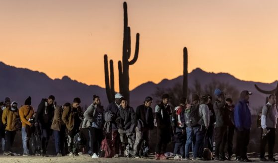 Illegal immigrants line up at a remote U.S. Border Patrol processing center in Lukeville, Arizona, on Dec. 7 after crossing the U.S.-Mexico border.