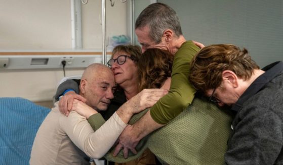 Hostage Luis Har, left, is hugged by relatives after being rescued from captivity in the Gaza Strip, at the Sheba Medical Center in Ramat Gan, Israel, on Monday.