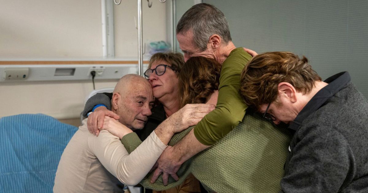 Hostage Luis Har, left, is hugged by relatives after being rescued from captivity in the Gaza Strip, at the Sheba Medical Center in Ramat Gan, Israel, on Monday.