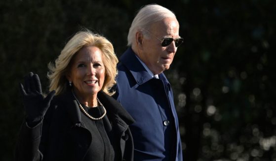 Joe and Jill Biden walk to board Marine One on the South Lawn of the White House