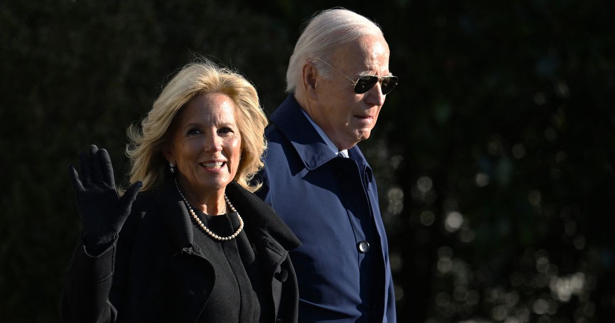 Joe and Jill Biden walk to board Marine One on the South Lawn of the White House