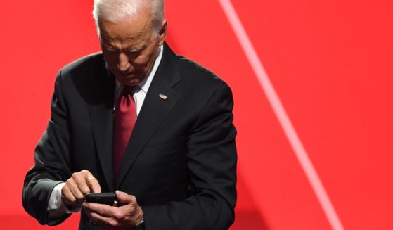 Then-presidential candidate Joe Biden looks at his phone after a debate at Otterbein University in Westerville, Ohio, on Oct. 15, 2019.
