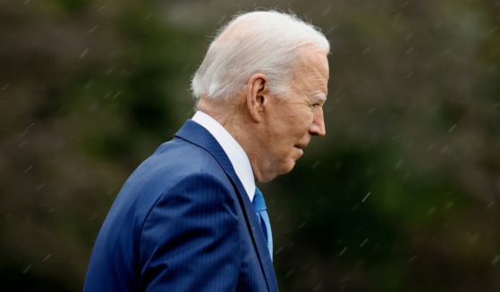 President Joe Biden walks across the South Lawn before boarding Marine One to depart the White House in Washington on Wednesday. "I'm going to Walter Reed to get my physical," Biden told reporters.