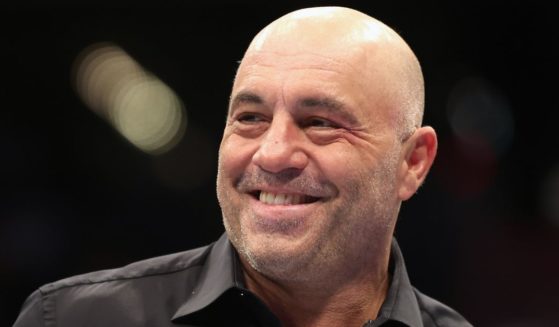 Color commentator Joe Rogan looks on during UFC 274 at Footprint Center in Phoenix on May 7, 2022.