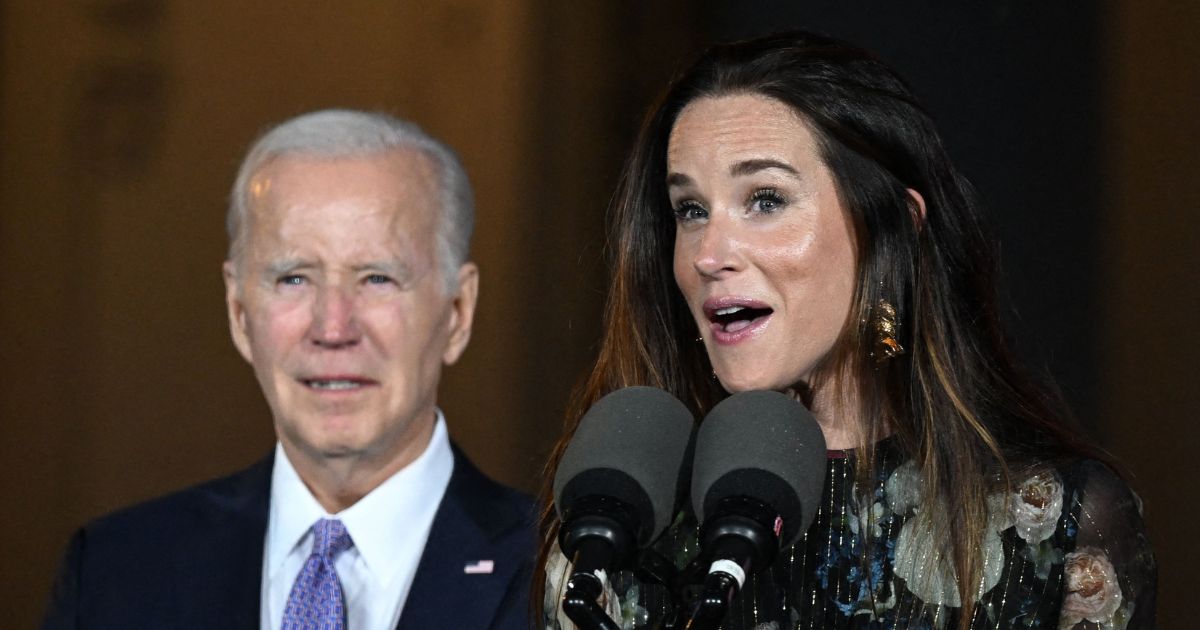 President Joe Biden looks on as his daughter Ashley Biden speaks during a Juneteenth concert on the South Lawn of the White House in Washington on June 13, 2023.