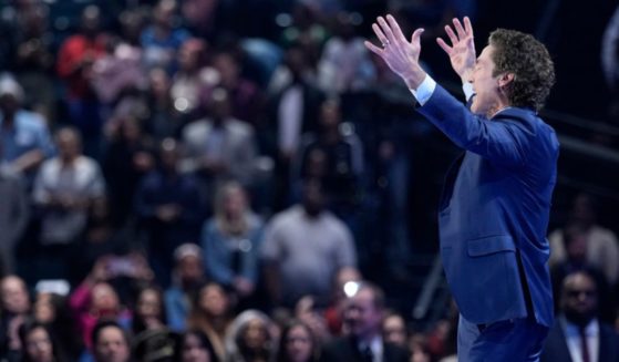 Pastor Joel Osteen preaches during a service at Lakewood Church Sunday, in Houston. Osteen welcomed worshippers back to Lakewood Church for the first time since a woman opened fire in between services at his Texas megachurch one week ago.