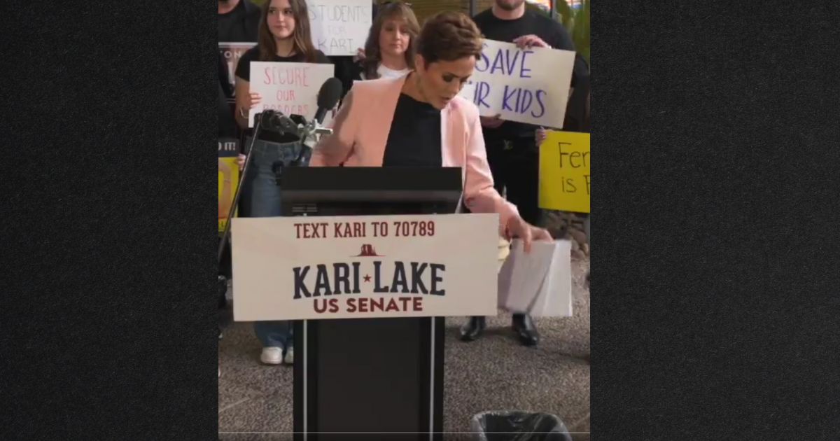 Senate candidate Kari Lake threw a copy of Congress' border bill in a wastebasket Wednesday, saying that's where the flawed plan belongs.