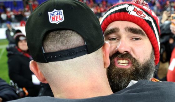 Jason Kelce, right, hugs brother Travis Kelce after the Kansas City Chiefs defeated the Baltimore Ravens in the AFC Championship Game in Baltimore, Maryland, on Jan. 28.