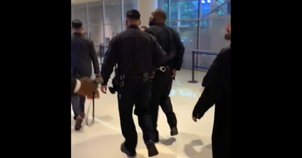 Killer Mike is escorted from the Grammy Awards in handcuffs.