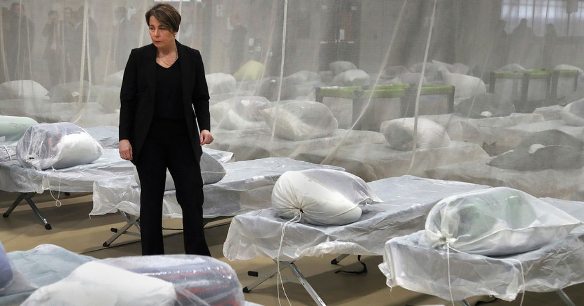 Massachusetts Gov. Maura Healey inspected cots set up on the gym floor in the Melnea A. Cass Recreational Complex Jan. 31 in the Roxbury neighborhood of Boston. The facility will house over 300 migrants.