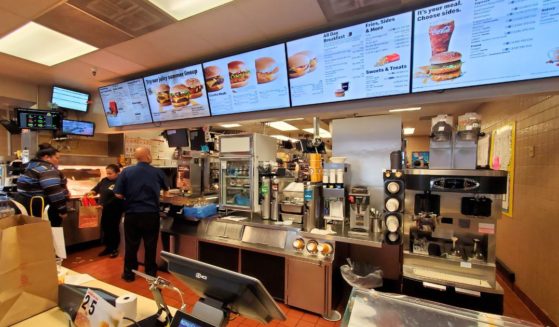 The counter area, kitchen and menus are visible in a wide-angle view of the interior of a McDonald's restaurant in San Ramon, California, on Jan. 21, 2020.