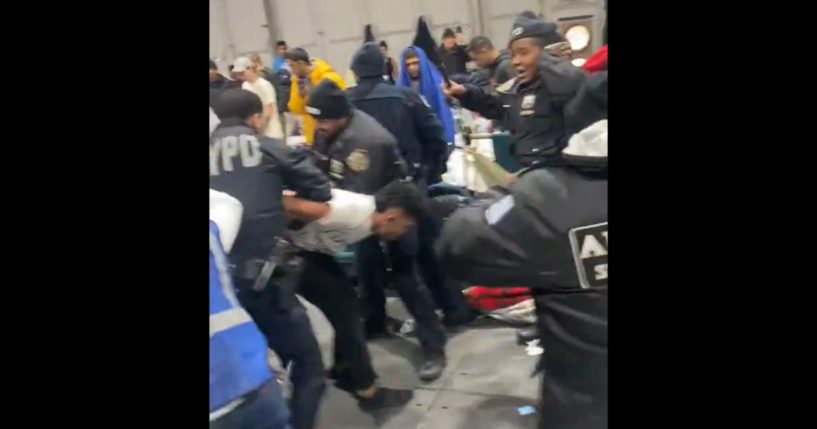 NYPD officers are attacked by immigrants at the city's Randall's Island shelter.