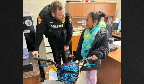 Alese Kircher posted a picture of her daughter Ellie with Westfield, New York, Police Chief Corbin Meleen, who saw to it that Ellie got a new bike after hers had been stolen.
