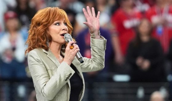 Reba McEntire sings the national anthem ahead of Super Bowl LVIII between the Kansas City Chiefs and the San Francisco 49ers at Allegiant Stadium in Las Vegas on Feb. 11.
