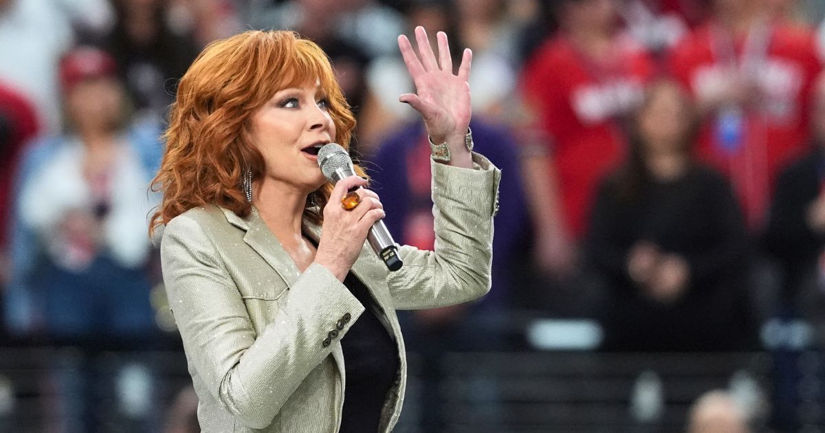 Reba McEntire sings the national anthem ahead of Super Bowl LVIII between the Kansas City Chiefs and the San Francisco 49ers at Allegiant Stadium in Las Vegas on Feb. 11.