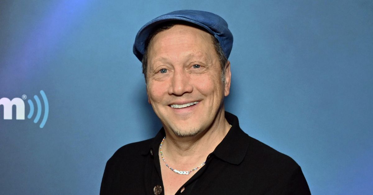Comedian Rob Schneider, seen in a June 2023 photo, told an interviewer that Jesus "grabbed" him and "hugged" him.