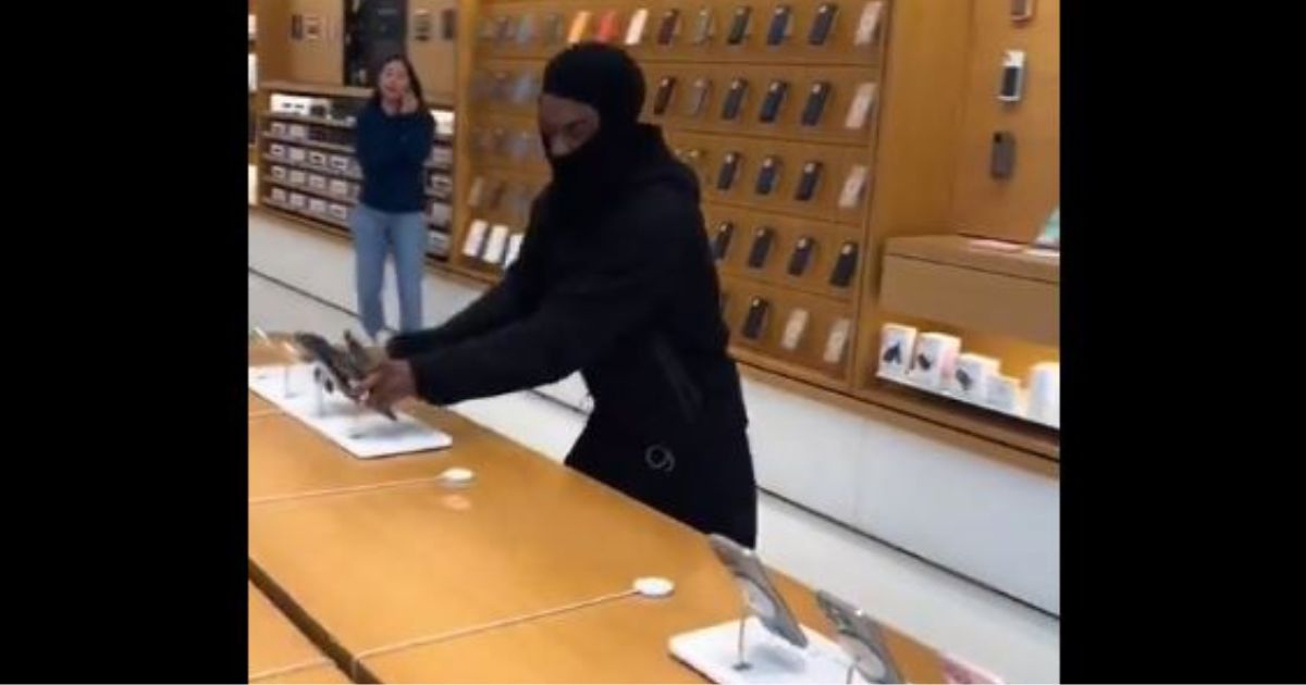 A video that went viral on social media shows a man ripping iPhones and other Apple merchandise from a store display Monday in Emeryville, California.
