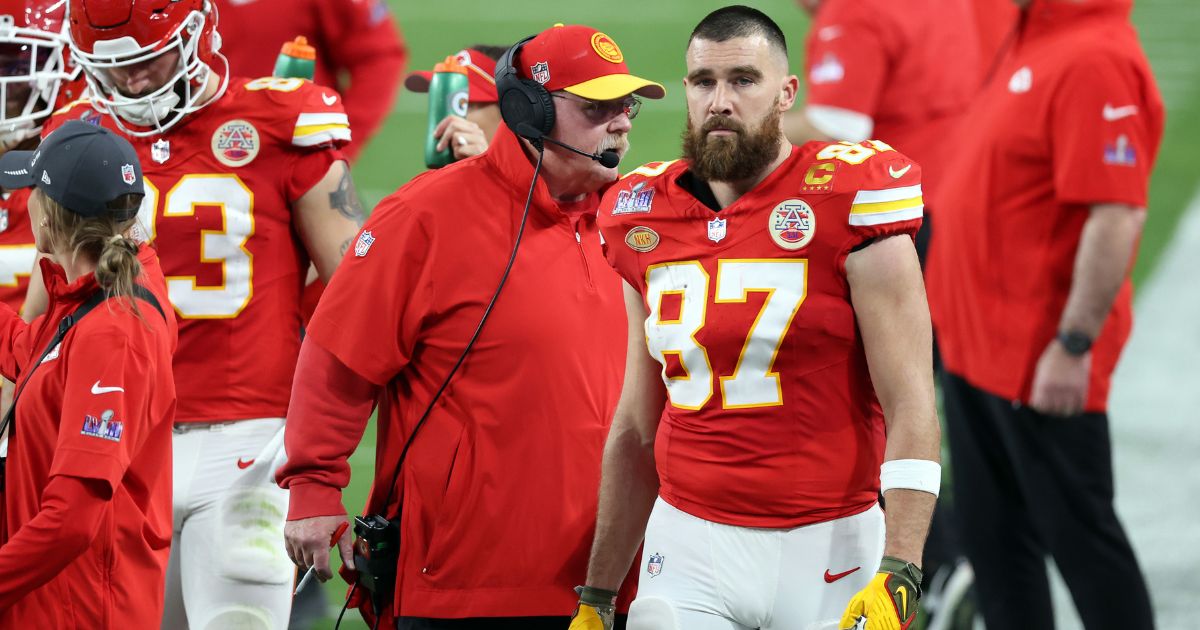 Kansas City Chiefs tight end Travis Kelce (87) and coach Andy Reid look on in the second quarter Sunday during Super Bowl LVIII in Las Vegas.