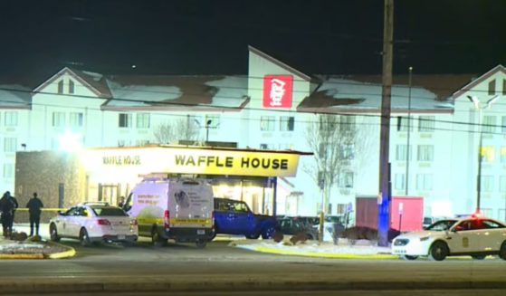 Police are at the scene of a shooting at a Waffle House in Indianapolis.