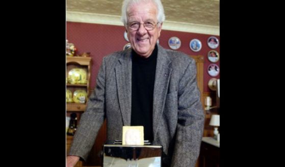 William Post poses with a Pop-Tart in 2003. Post, who played an important role in the development of the Pop-Tarts toaster pastry, died Saturday. He was 96.