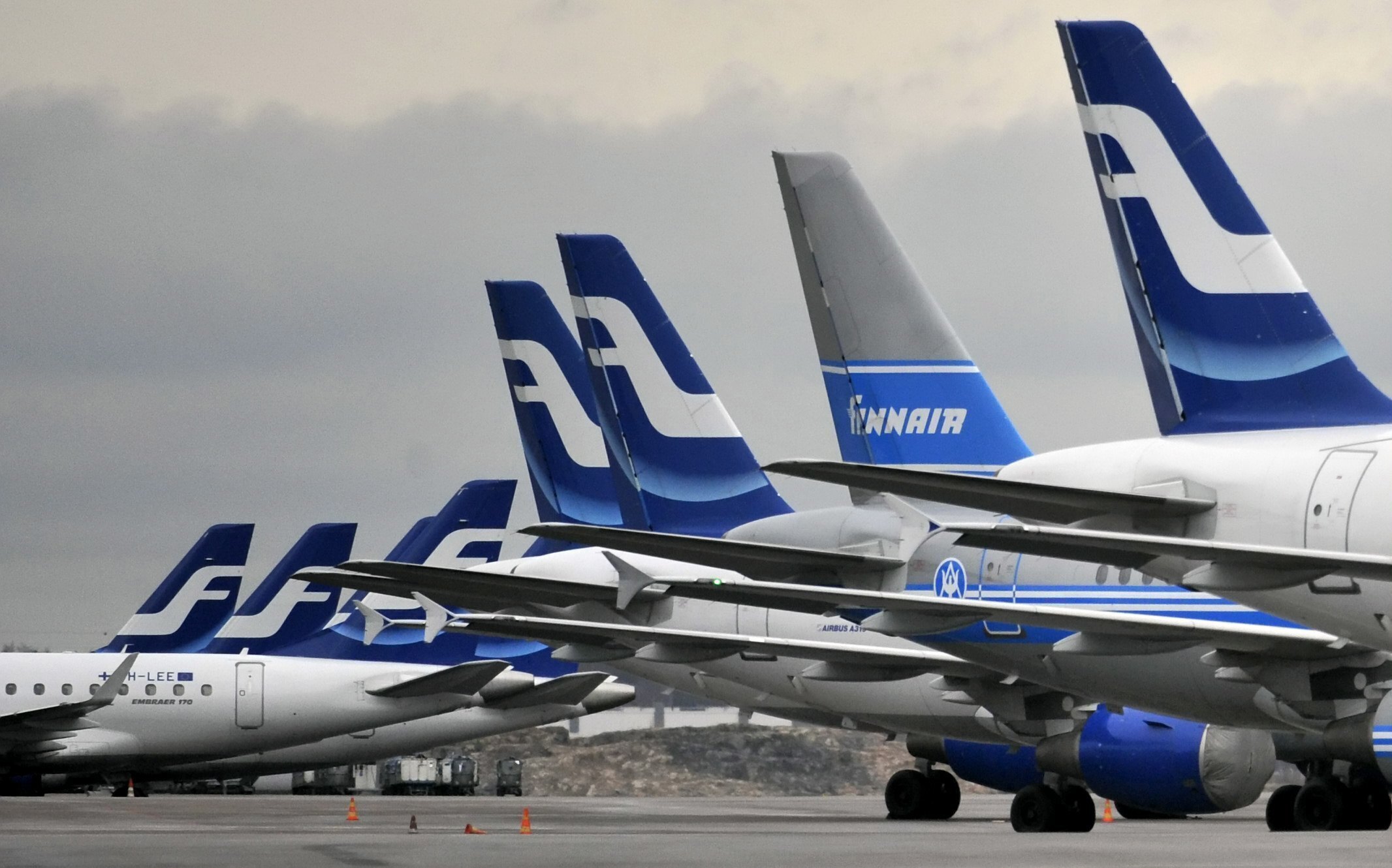 Passenger planes of the Finnish national airline carrier, Finnair, sit on the tarmac at Helsinki Airport in 2009.