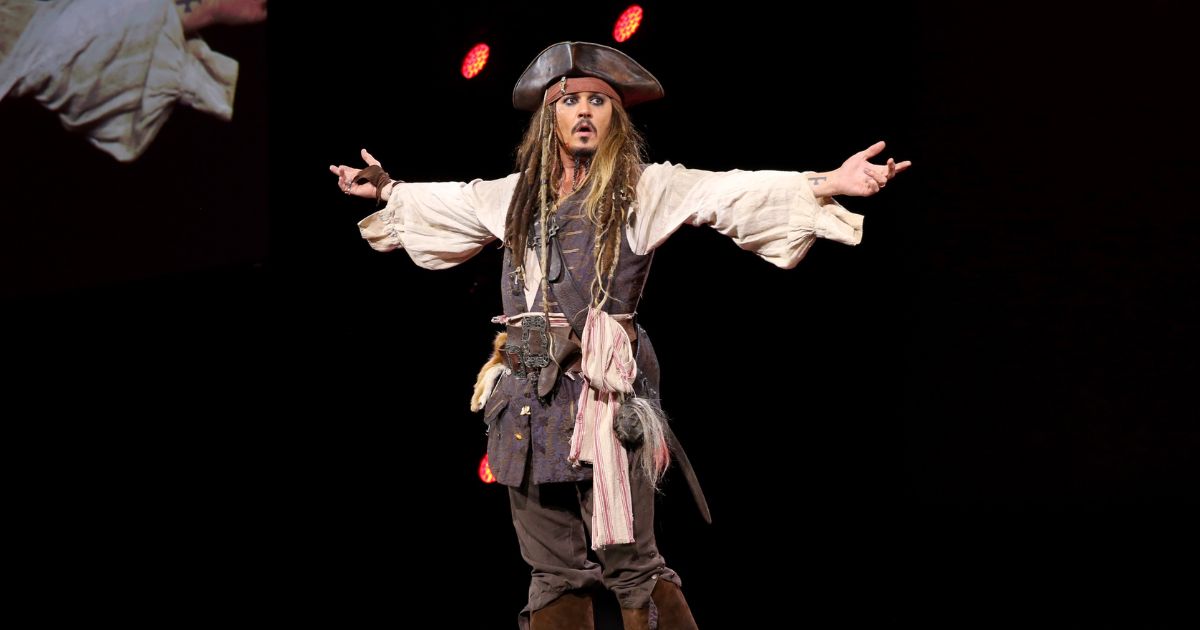 Actor Johnny Depp, dressed as Captain Jack Sparrow, of PIRATES OF THE CARIBBEAN: DEAD MEN TELL NO TALES took part today in "Worlds, Galaxies, and Universes: Live Action at The Walt Disney Studios" presentation at Disney's D23 EXPO 2015 in Anaheim, Calif.