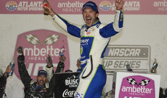 Daniel Suarez celebrates after winning the NASCAR auto race at Atlanta Motor Speedway in Hampton, Georgia, on Sunday.