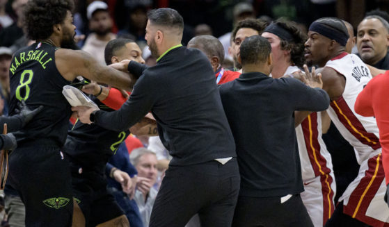 Miami's Jimmy Butler, far right, and New Orleans' Naji Marshall, far left, get involved in a scuffle during the fourth quarter of an NBA game in New Orleans on Friday night.