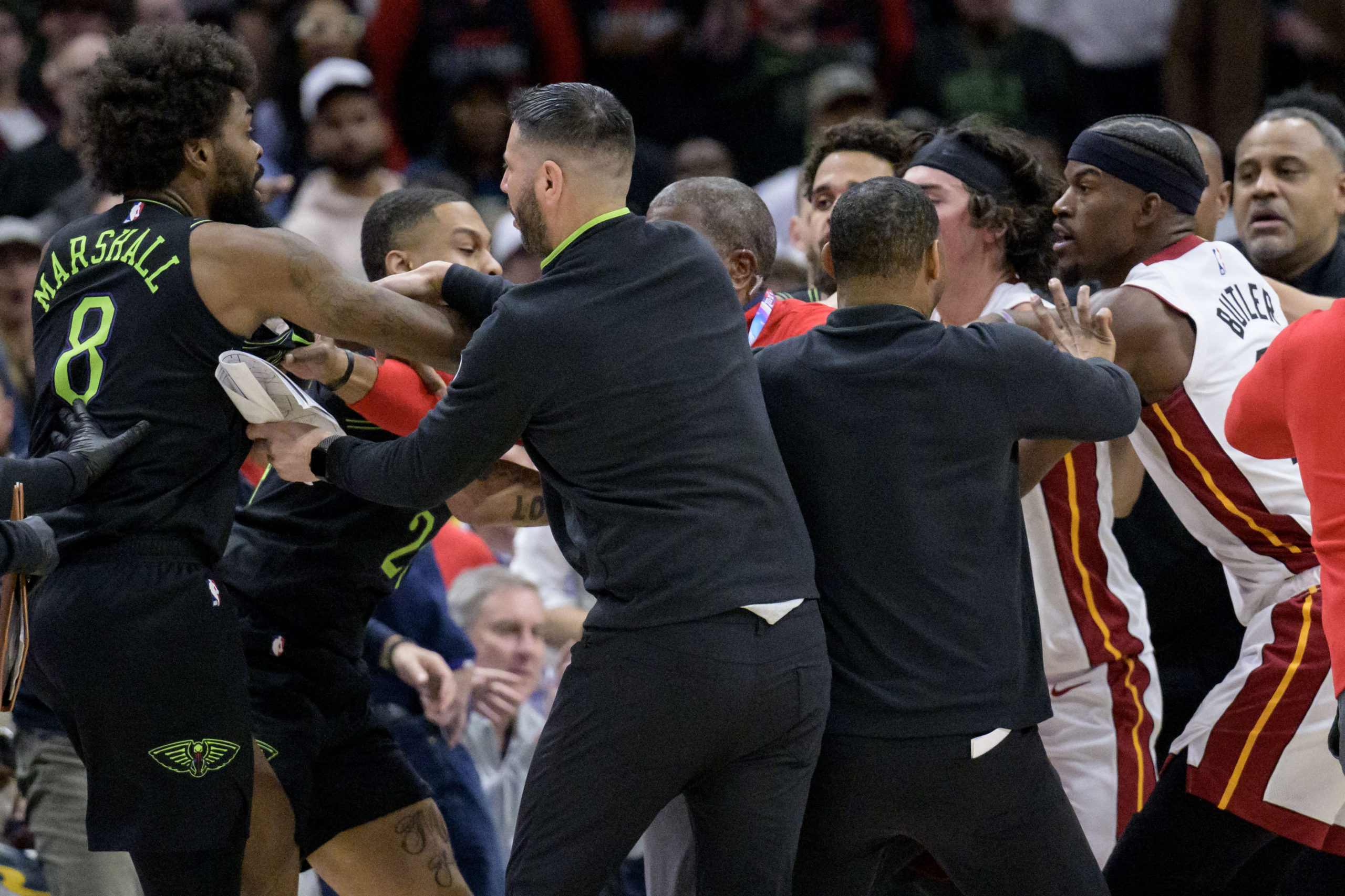 Miami's Jimmy Butler, far right, and New Orleans' Naji Marshall, far left, get involved in a scuffle during the fourth quarter of an NBA game in New Orleans on Friday night.