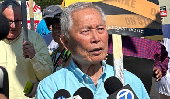 Actor George Takei, pictured in a September file photo from an actors' union picket line.