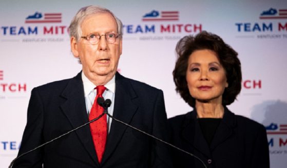 Senate Minority Leader Mitch McConnell and his wife, Elaine Chao, are pictured in a 2020 file photo after McConnell's re-election.