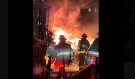Firefighters on the scene Saturday night in San Francisco's Chinatown where an autonomous vehicle was set on fire by a crowd.