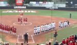 Softball players from the University of California, Berkeley, kneel during the national anthem prior to a Feb. 9 game at the University of Louisiana, Lafayette.