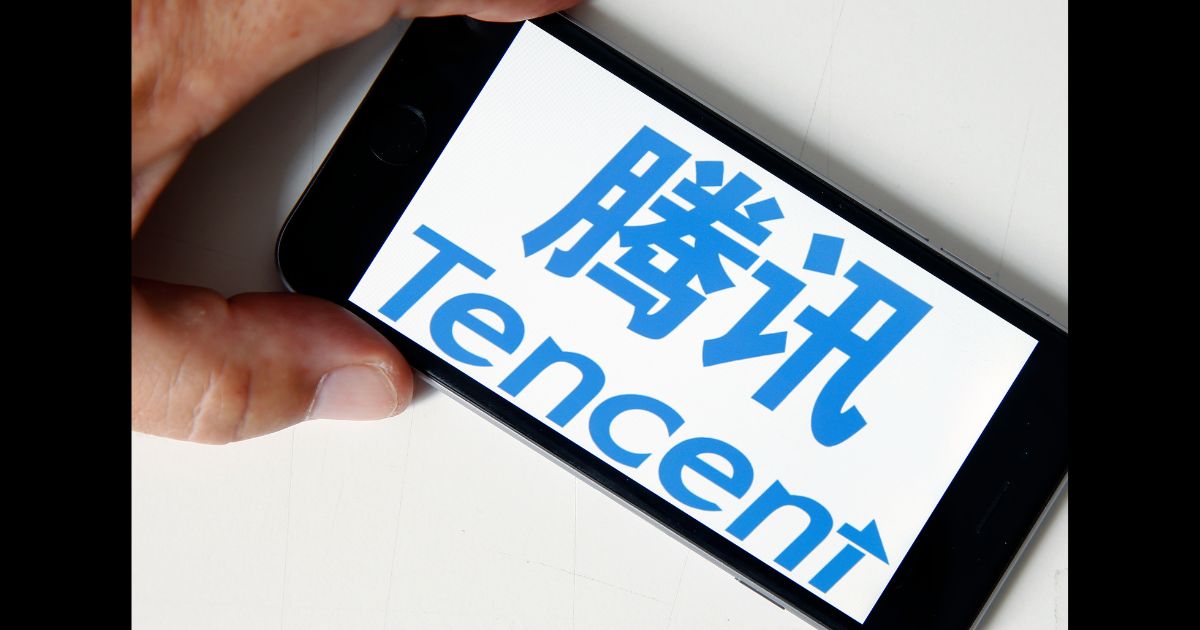 In this photo illustration, the logo of Chinese tech company Tencent is displayed on the screen of an iPhone on June 6, 2018 in Paris, France.