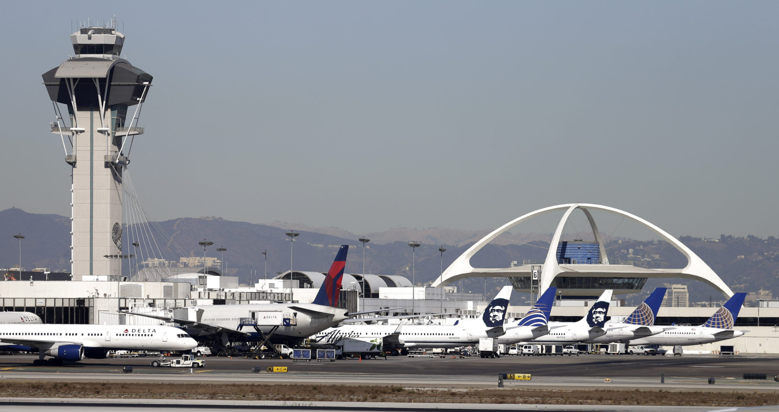 Airplanes sit on the tarmac at Los Angeles International Airport in a file photo from November 2013.