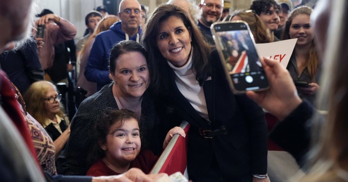 Nikki Haley poses for a selfie with supporters