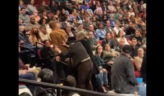 A climate activist on Thursday interrupted a Broadway performance of "An Enemy of the People," starring Sopranos actor Michael Imperioli, who, with other actors, stayed in character while they pushed the man out of the theater.